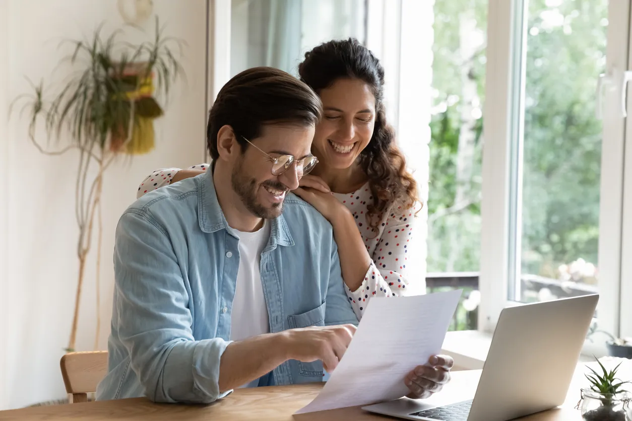 Happy couple reading results